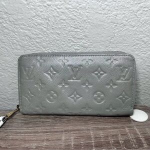 Louis Vuitton Monogram Empreinte Gray Wallet cream interior.